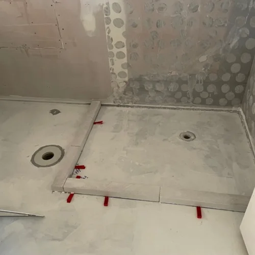 Bathroom floor tiling in progress